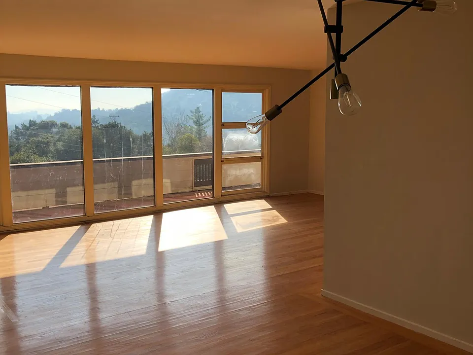 Large living room w formal dining area attained New doors to open to large wrap around deck