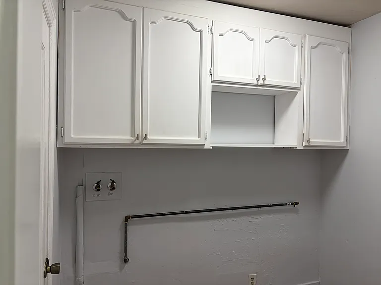 Laundry area with cabinets and hookups for a washer and dryer. (Sorry, but washer and dryer are not included in the rental)