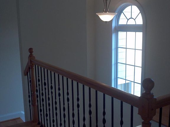 Third floor balcony overlooks living room