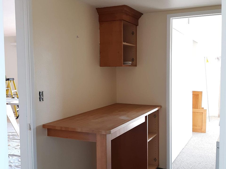 Folding table in laundry area. Beautiful slate floor.