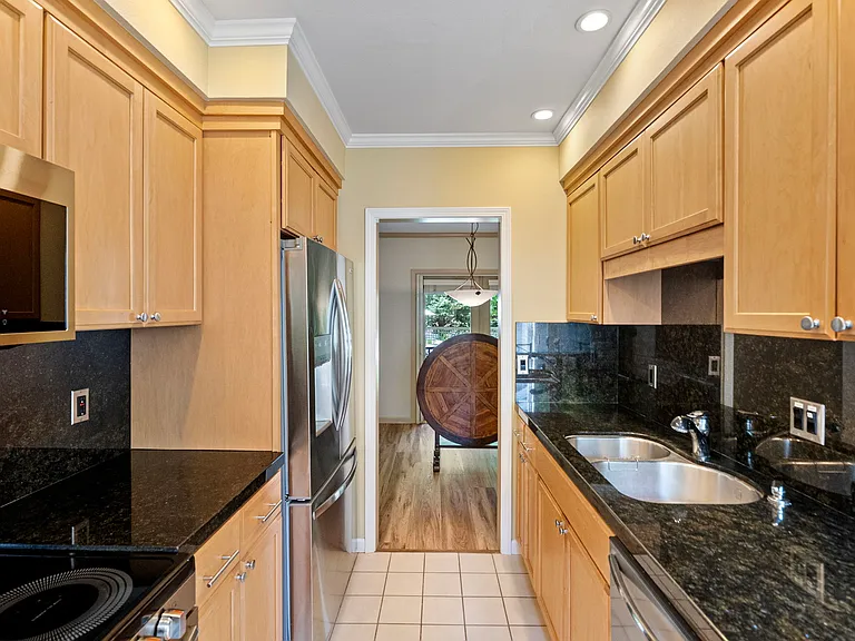 Kitchen view into dining/living area