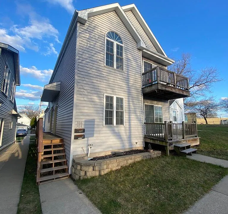 Front of home with Side doors to units