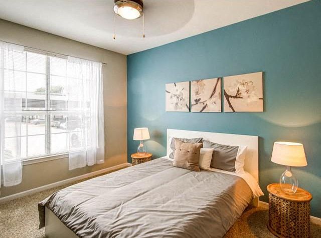 Master Bedroom with ceiling fan and lots of natural light