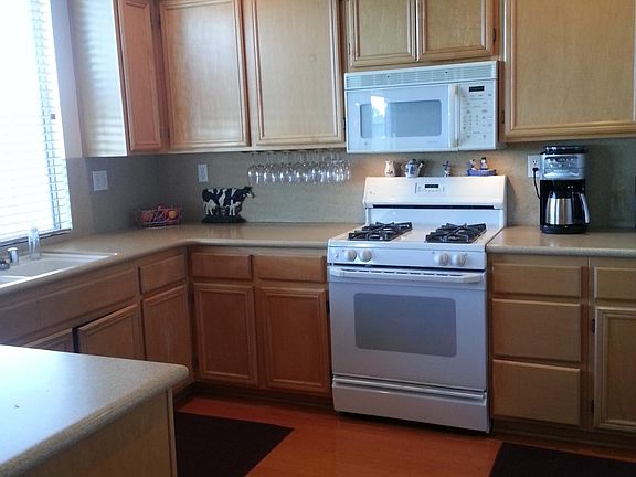 Kitchen, just past dining room, window looks out on golf course