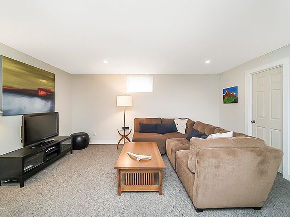 Lower level recreation room is carpeted and is adjacent to future bath (plumbed for bath) and large storage areas and mechanical room.
