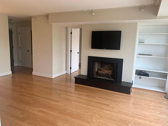 Living room with wood burning fireplace