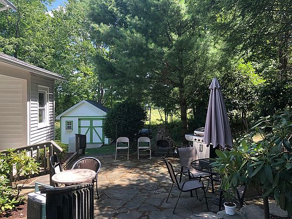 Stone patio with fireplace