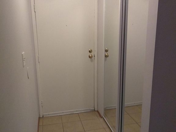Tiled entry to keep it clean and mirror doors on the closet.