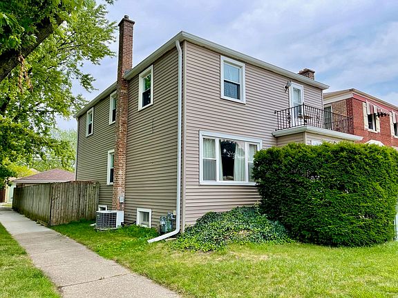 Large corner lot with fenced yard and detached garage.