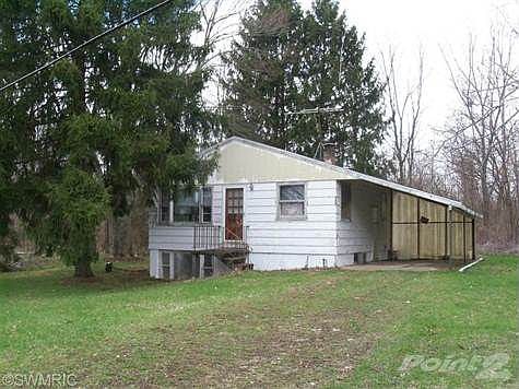 Home sits on nearly 2 wooded acres!