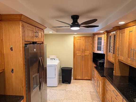 Large kitchen with clothes dryer