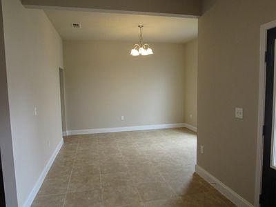 The formal dining room is to the right of the front entrance when entering the house.