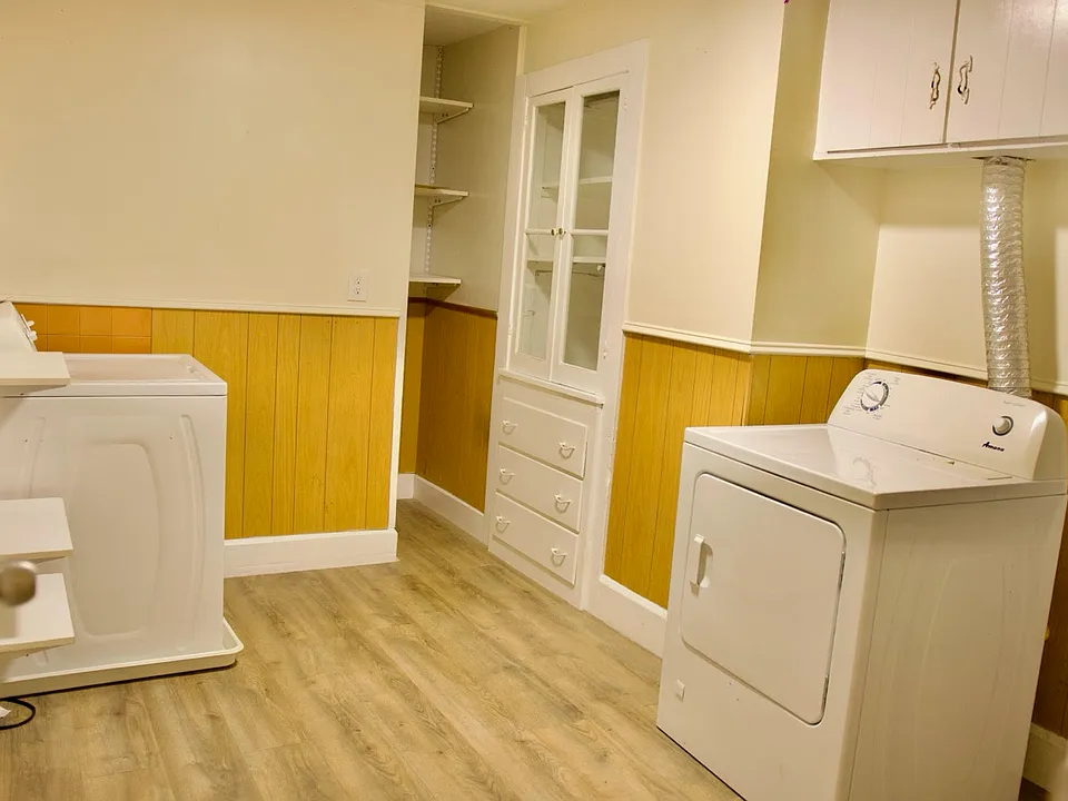 Laundry area with washer and dryer included.