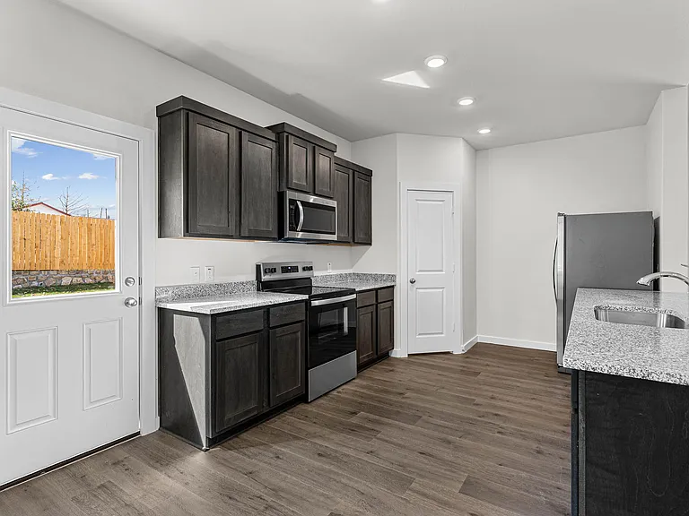 The kitchen has a wonderful breakfast bar.