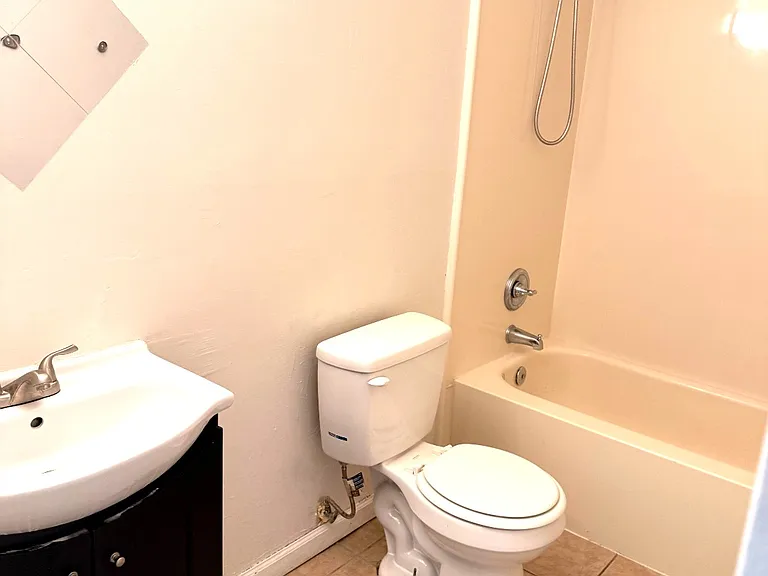 Bathroom vanity and tub area