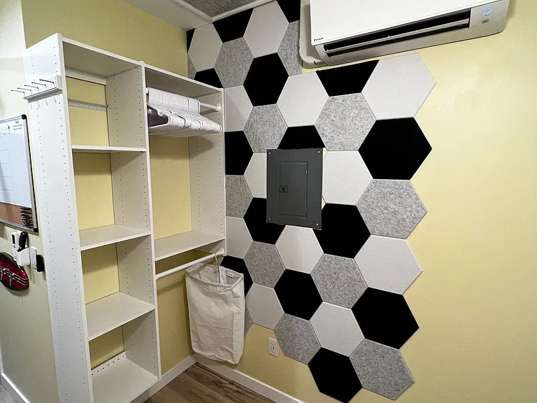 Closet area, AC/heat unit, sound-deadening wall tiles
