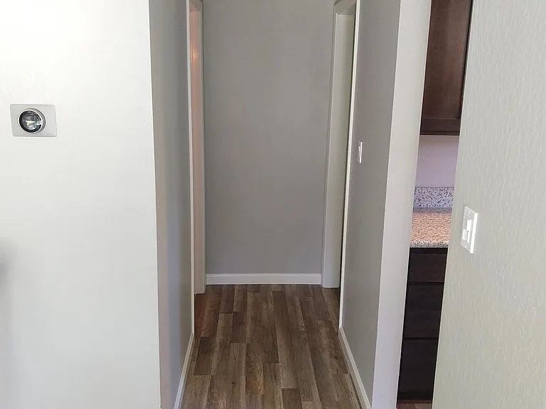 Downstairs hallway to half bath, Laundry room and 2 car garage
