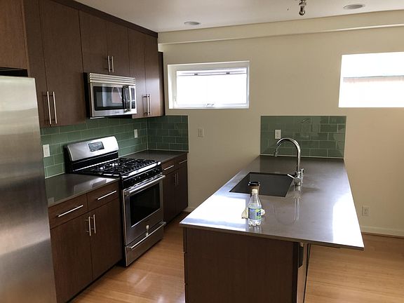 Kitchen, island. Includes garbage disposal, bar stool seating.