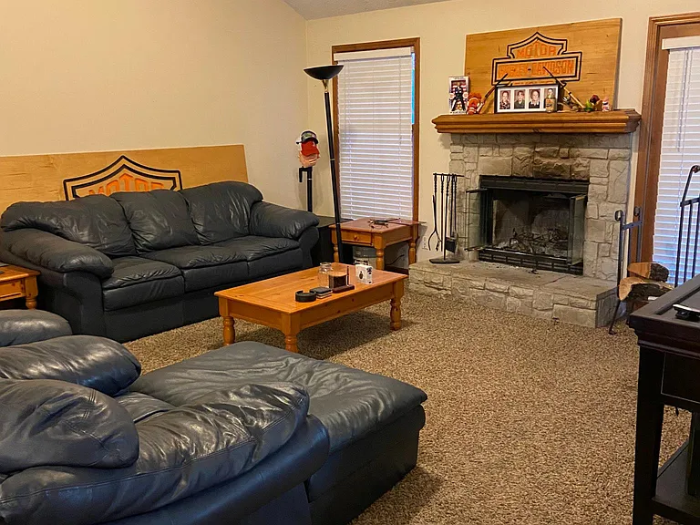 Living Room With Fireplace. Vaulted Ceilings