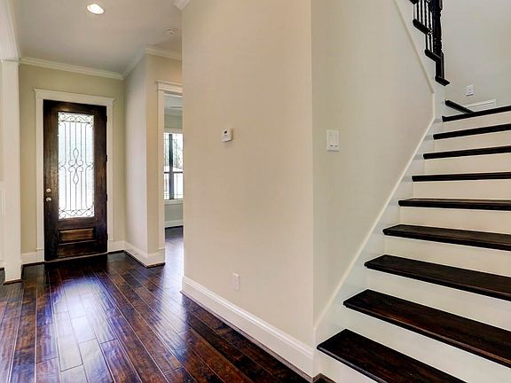 Upon entering this wonderful home, through the glass and wrought iron door you will be greeted with high ceilings, fantastic natural light and hardwood floors.