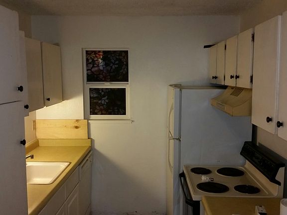 Kitchen with fridge and stove