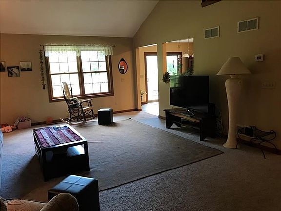 Walk right into this spacious living room with cathedral ceiling.