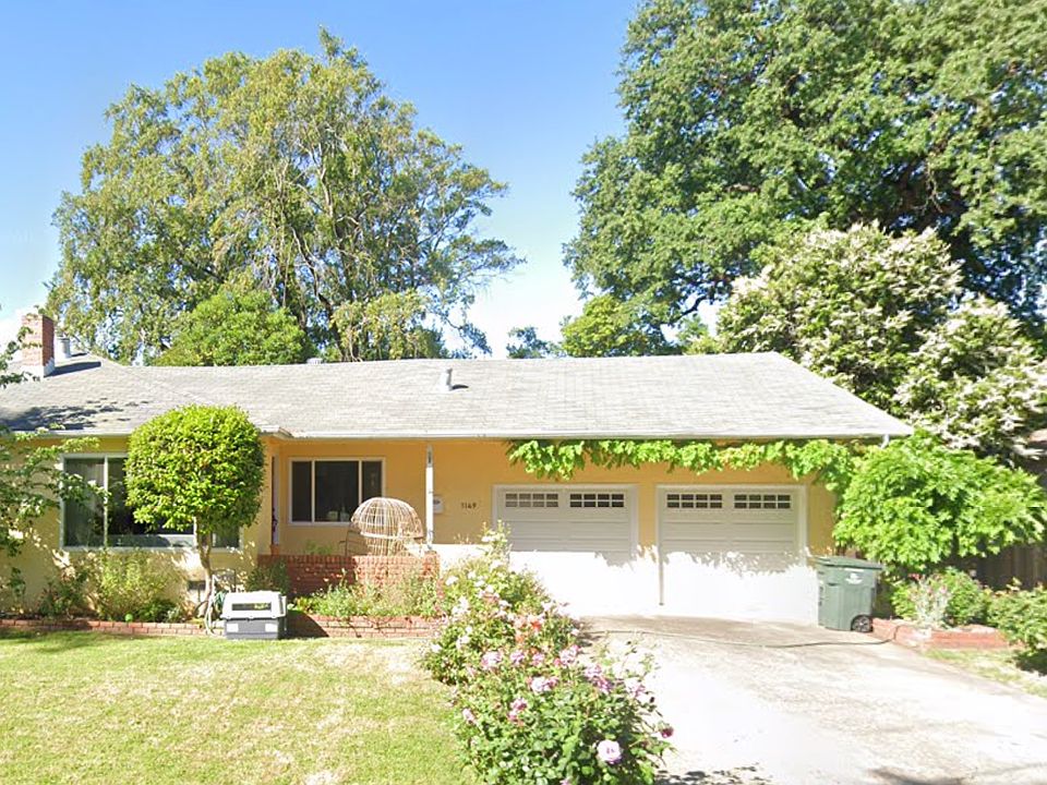 Front Yard and driveway with rose garden