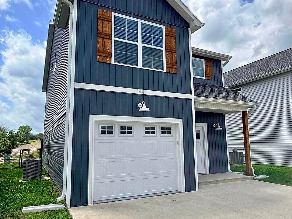 Front exterior--1-car garage with 2-car driveway