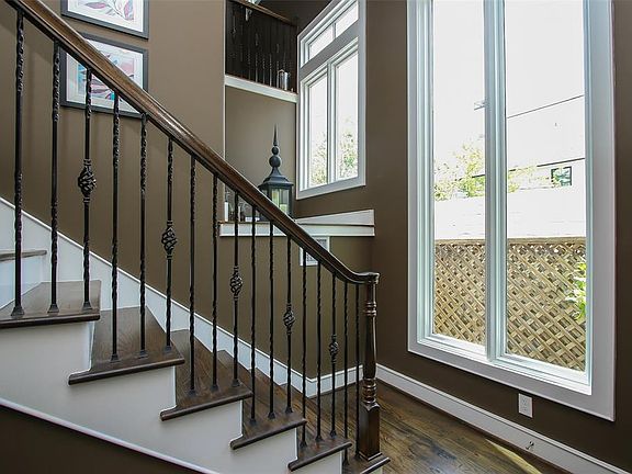 Huge windows flood this home with light. There is smart home enabled lighting and integrated wireless network throughout.