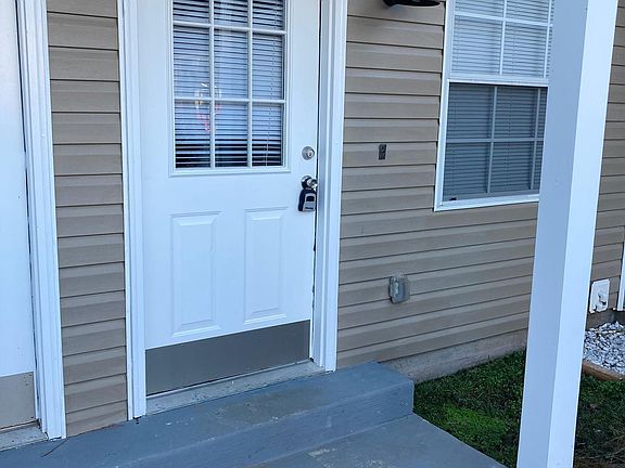Covered stoop very close to parking area for convenience.