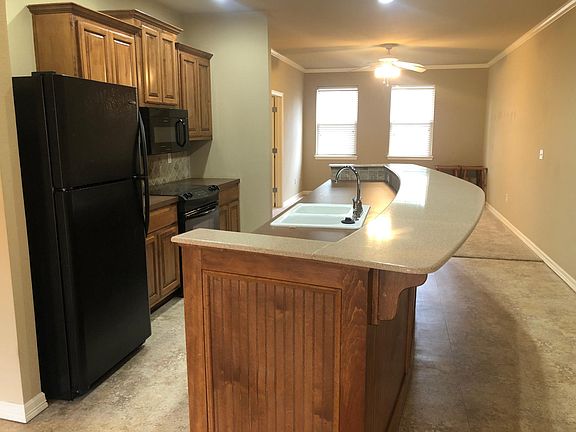 Open kitchen with huge island for dining or entertainment. Island bar is over 10ft long