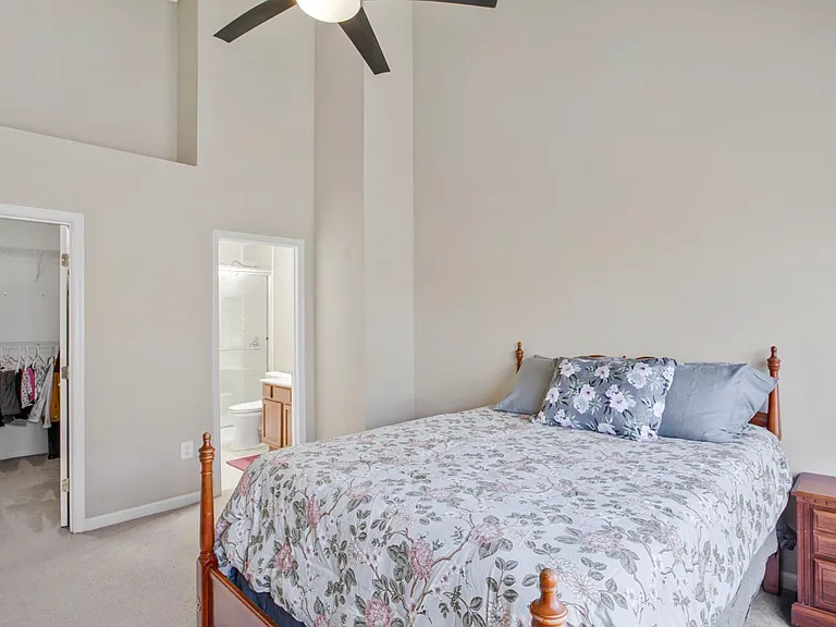 Spacious and filled with natural light from oversized picture windows, the primary suite offers a true retreat complete with a large walk-in closet and private ensuite bath.