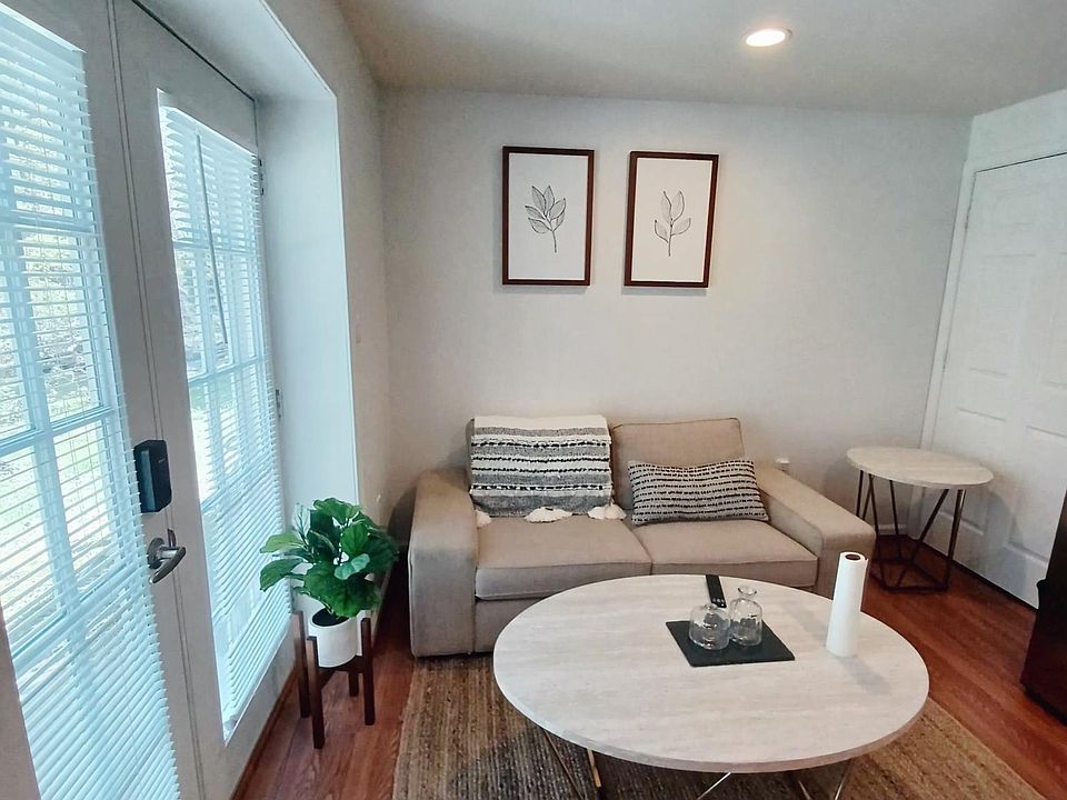 Cozy living room with the entrance through the french doors shown on the left.