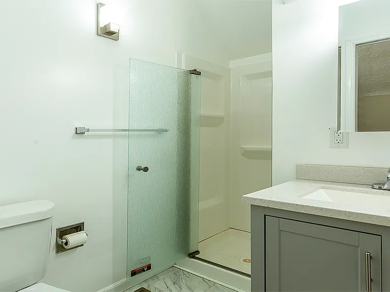 2nd floor full bathroom with walk-in shower.