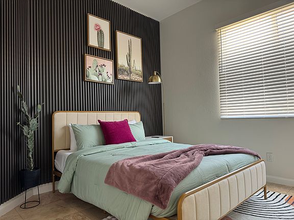 tastefully design second bedroom comes with a comfortable queen bed
