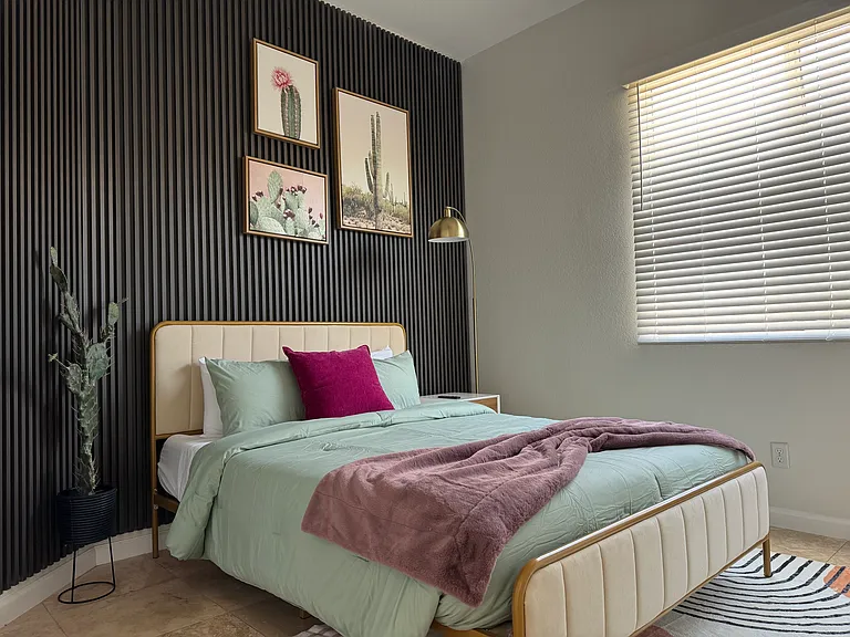tastefully design second bedroom comes with a comfortable queen bed