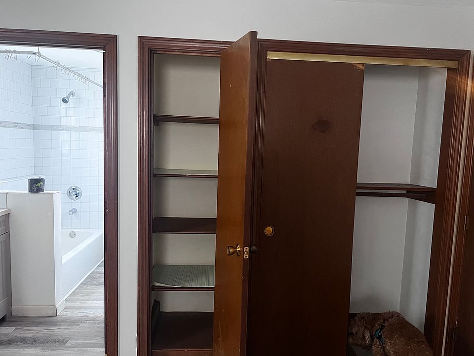 Bedroom closet and full bathroom. Closet has sliding door and there is a closet with shelves to hold your toiletries and towels.