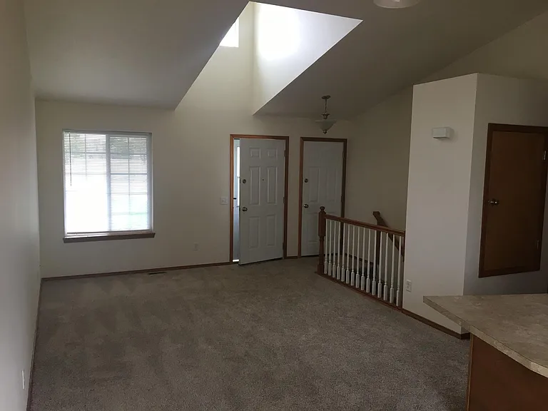Entrance from porch and garage (2-car), and living room.