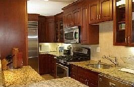 Luxury kitchen with granite counters, sub-zero refrigerator...