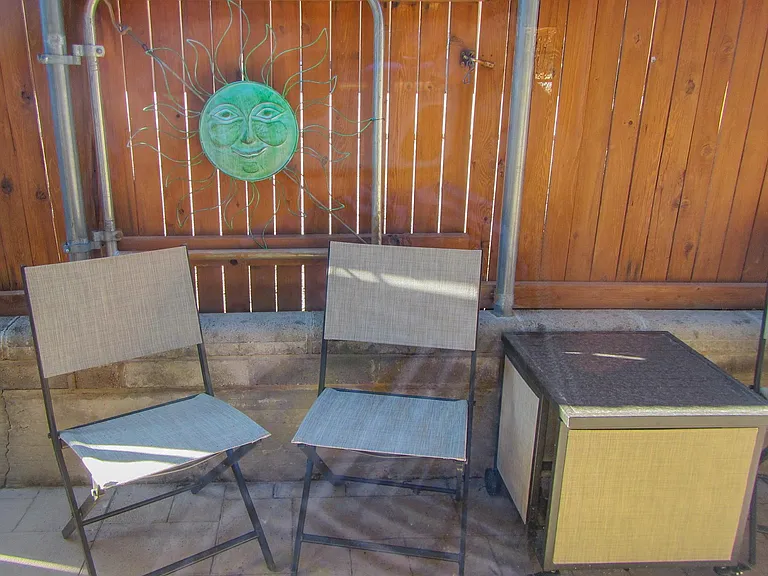 patio in fenced back yard area
