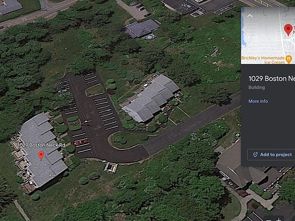 As you can see in the aerial photograph. It is the building and the red pin on top on the unit. 
The building and unit is some distance from Boston Neck Rd