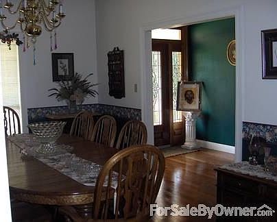 Dining and Front Entry
						:
						Leaded, Beveled Mahogany Front door, wood floors and dining with elegant light