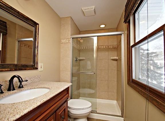 Updated master bathroom new fixtures, shower door and wonderful granite counter and vanity!