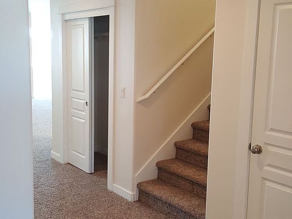Entrance; Foyer; door to garage; stairs to bonus upstairs