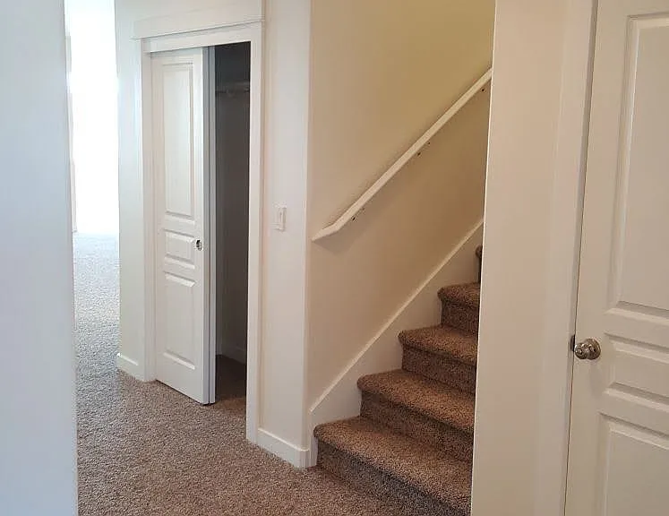 Entrance; Foyer; door to garage; stairs to bonus upstairs