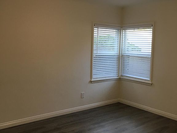 West Bedroom: New windows. New vinyl plank floors. New light fixture.
