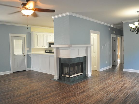 Corner fireplace with gas logs.
