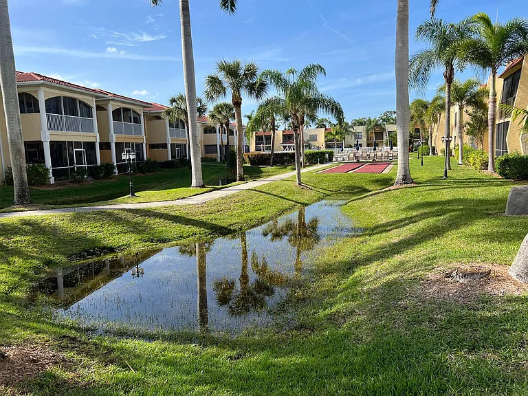 Walk way to shuffleboard and pool beyond.