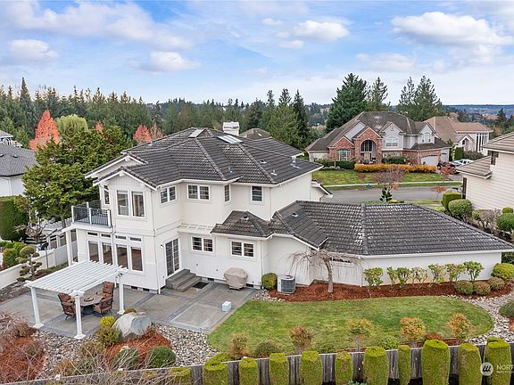 Over 1/4 Acre Landscaped Lot . Large entertainment sized patio with Pergola. Gas Stub & Hot Tub Stub . 2 Decks one off Master with incredible views and one off a secondary bedroom .>