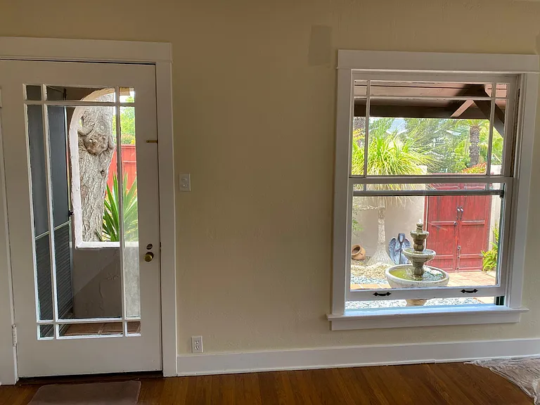 Living room front door, view to front gate and fountain